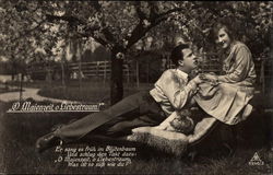 Couple in the garden in springtime Postcard