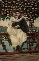 Couple hugging each other while sitting on a bridge Postcard