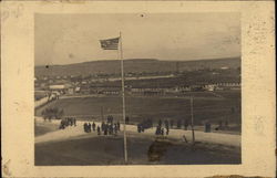 Soldiers Beneath Flag Pole Postcard
