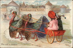 Two Children Riding a Turkey Cart to Thanksgiving Towne Postcard