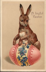 Rabbit with Pink and Blue Floral Patterned Easter Egg Postcard