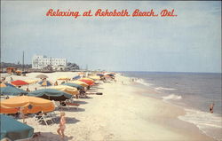 Relaxing on the beach Rehoboth Beach, DE Postcard Postcard