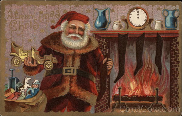 Santa holding toy car next to fireplace Santa Claus