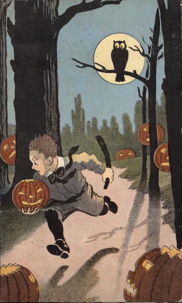 Boy in woods with Jack-O-Lantern Halloween
