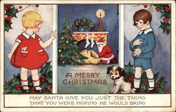 A Merry Christmas - Boy and Girl with Santa Claus at Chimney Postcard