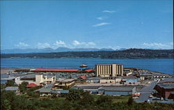 Overlooking Shopping District & Discovery Inn Postcard