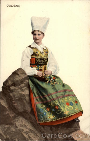 Austrian Girl Sitting on Rock in Traditional Dress
