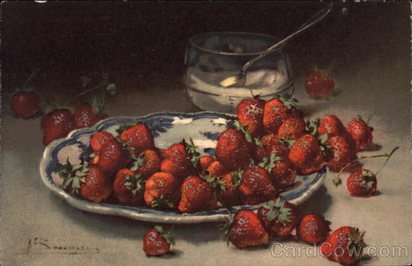 Strawberries on a blue pattern plate with sugar bowl
