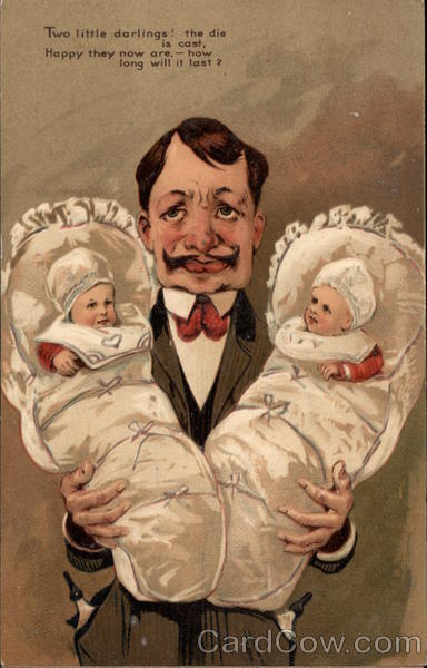 Father Holding Twins Babies