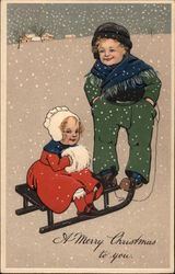 Boy and Girl with TOboggan Postcard