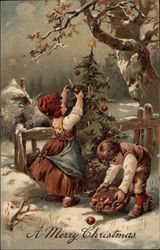 Children Collecting Apples and Decorating a Christmas Tree Outside Postcard