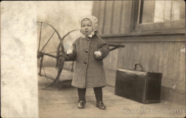 Young Child in Coat and Hat Children