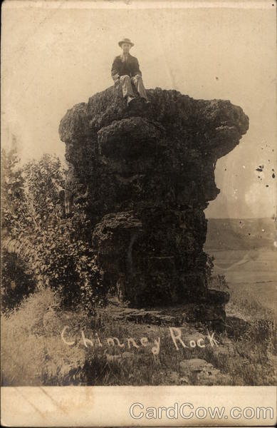 Man Sitting on Top of Chimney Rock Wisconsin Dells