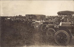 Line of Old Automobiles Postcard