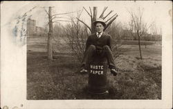 Man in Waste Paper Barrell Postcard
