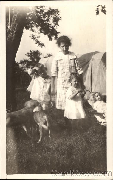 Three Children Playing with Dogs with Tent