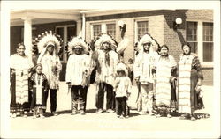 Several Native Americans Posing in Full Costume Postcard
