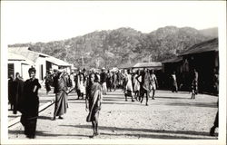 A typical village street during a day of trading Postcard