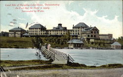 Land Side of Rangeley Lake House, Demonstrating Fact that the Hotel is nearly Surrounded by Water Postcard