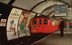 Tube Train entering Piccadilly Circus Station Postcard