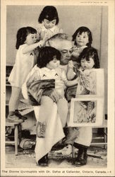 The Dionne Quintuplets with Dr. Dafoe at Callander Ontario, Canada Misc. Canada Postcard Postcard