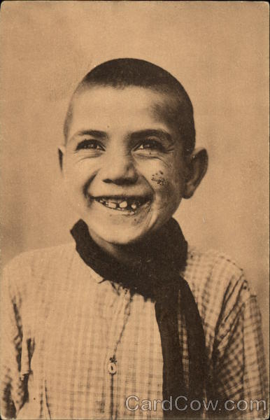 Boy in checked shirt with toothy smile Italy