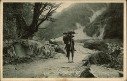 Man Carrying Large Pack in Mountains Postcard