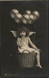 Child Posing in Basket with Wings Postcard