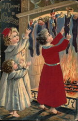 Children Check Christmas Stockings by Fireplace Postcard