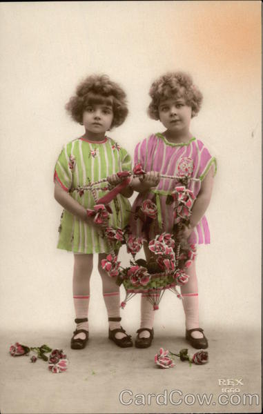 Two Young Girls holding Flower Basket