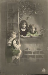Boy Climbing Ladder to Two Girls in Window Postcard
