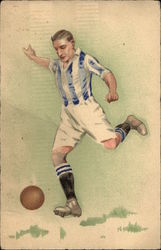 Man in Blue Sriped Shirt and White Shorts Kicks Soccer Ball Man in Blue Sriped Shirt and White Shorts Kicks Soccer Ball