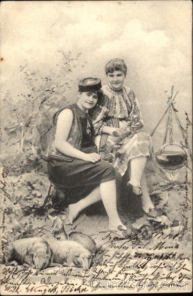 Two Women Sitting by a Campfire