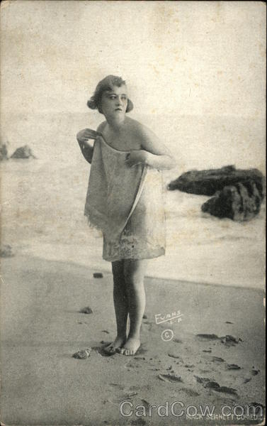 Photograph of Woman Wrapped in Towel on the Beach Women