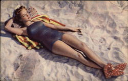 Woman in Blue Swimwear Lying on Beach Postcard