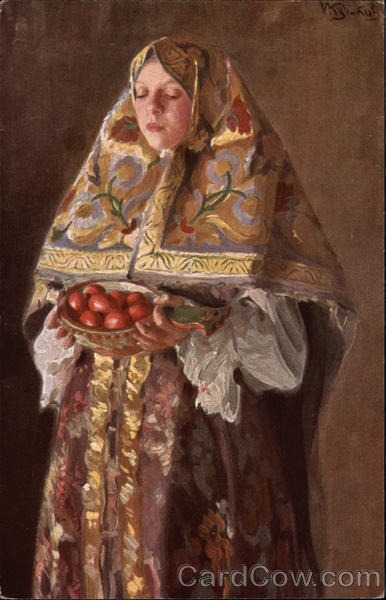 A woman in a colorful shroud holding a bowl of apples.