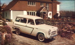 British Car in Front of Home Postcard
