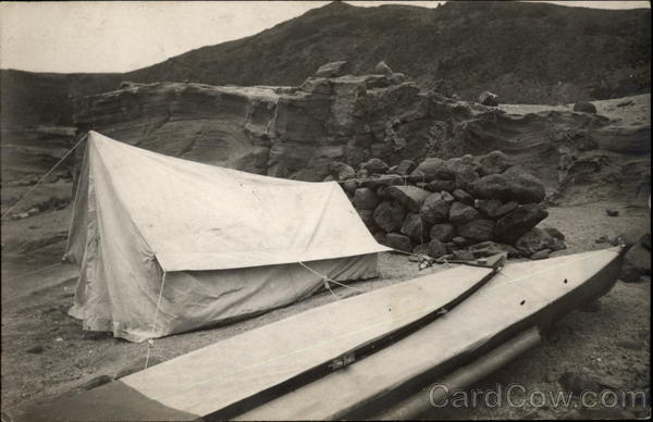 A Tent and Boat at a Campsite Camping