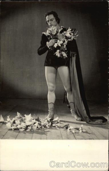 Actor wearing Cape & Tights on Stage with Flowers Actors