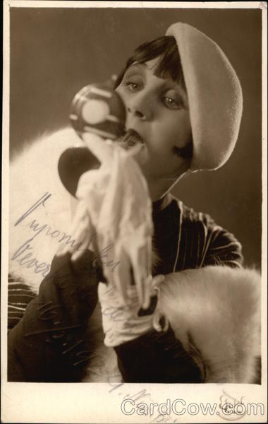 Woman in Fur Stole Applying Lipstick Women