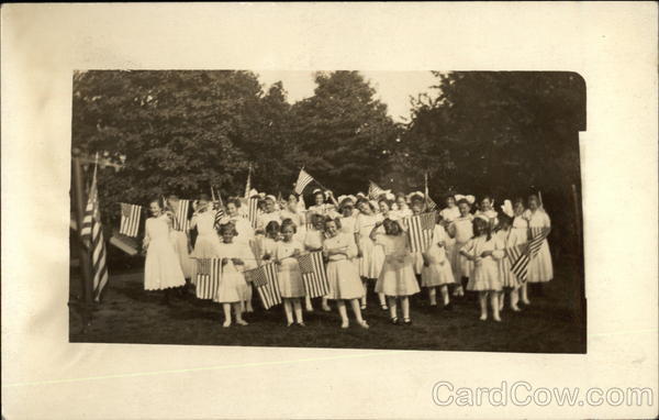 Group of Girls in White holding American Flags Patriotic