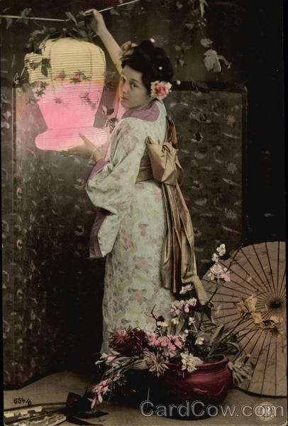 Asian Woman Hanging Lantern
