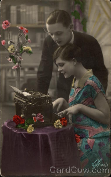 Couple at Flower Covered Typewriter Table Typewriters
