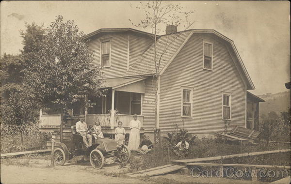 House with Family and Automobile in the Front Cars