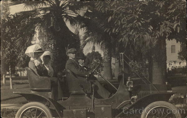 Two Men & Two Women in Model T Automobile Cars