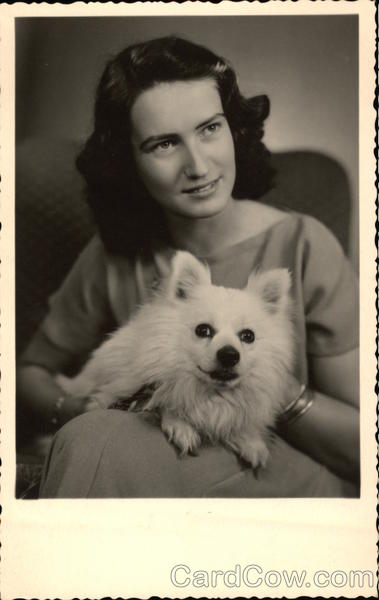 Brunette Woman holding White Dog Dogs