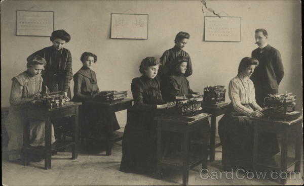 Women in long dresses typing