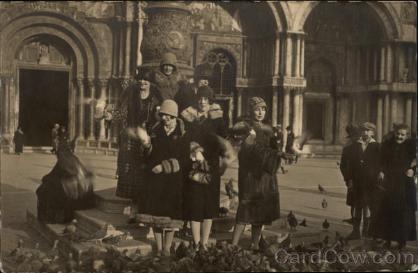 Feeding the PIgeons in St. Mark's Square Venice Italy