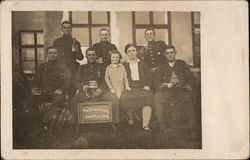 A Group of Soldiers with Drinks and a Woman and Child Postcard