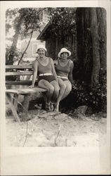 Two Women in Swimwear Sitting on Bench Postcard